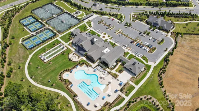 an aerial view of a house with a swimming pool