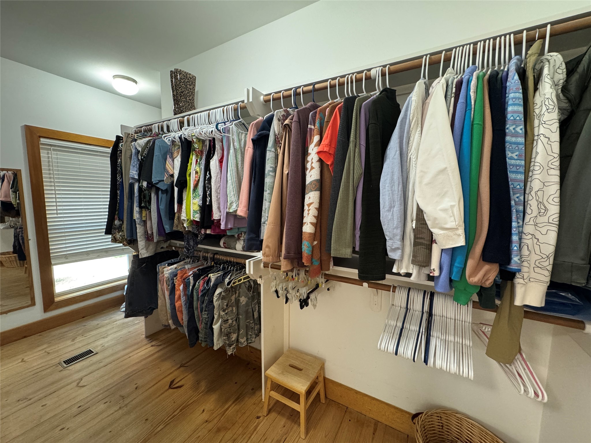 55 Lake Road Huntsville, TX 77320 - Photo 20 of 50 If this is not enough hanging space, there’s more around the corner. This closet is L-shaped, and it also has a built-in chest of drawers and lots of shelving.