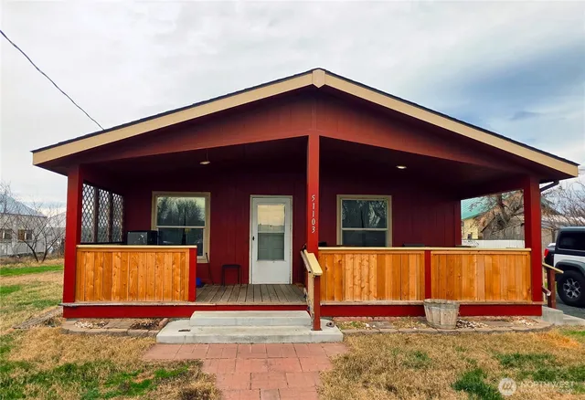 an entrance to house with yard