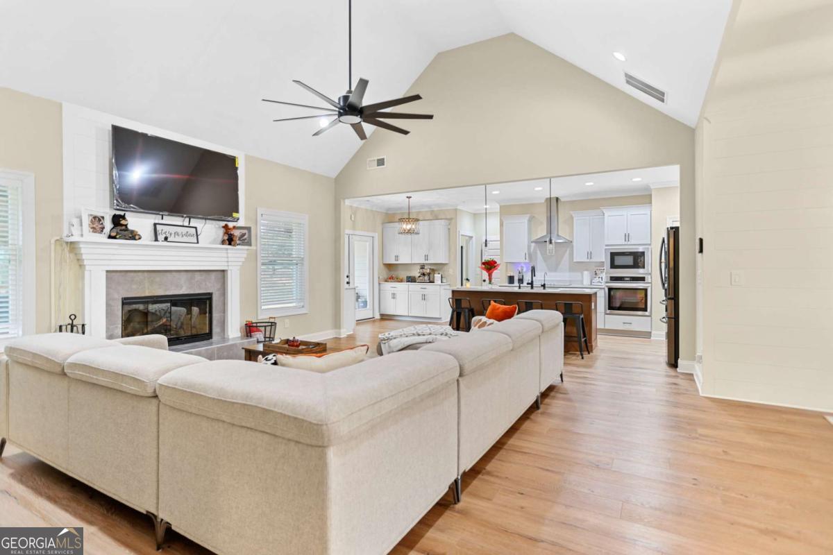 294 Conner Lane Williamson, GA 30292 - Photo 13 of 62 a living room with furniture fireplace and flat screen tv