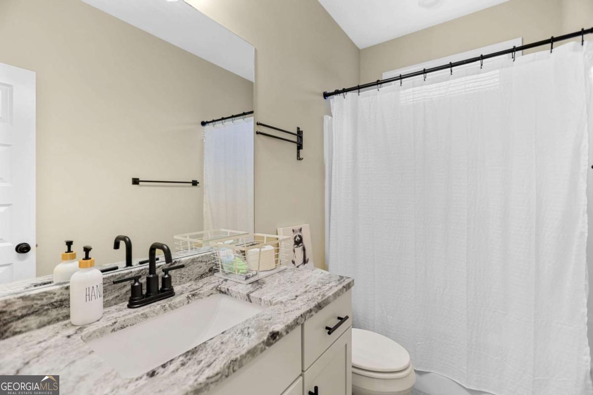 294 Conner Lane Williamson, GA 30292 - Photo 15 of 62 a bathroom with a granite countertop sink and a mirror