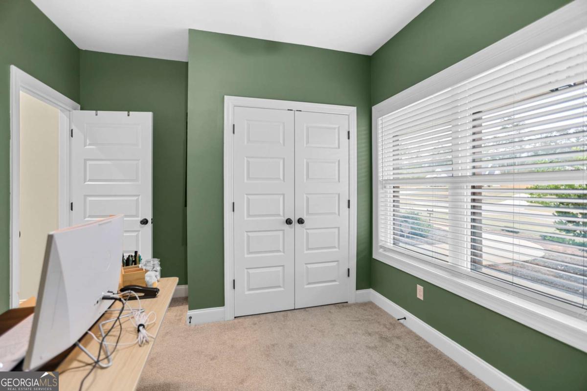 294 Conner Lane Williamson, GA 30292 - Photo 17 of 62 a view of a livingroom with an empty space and a window