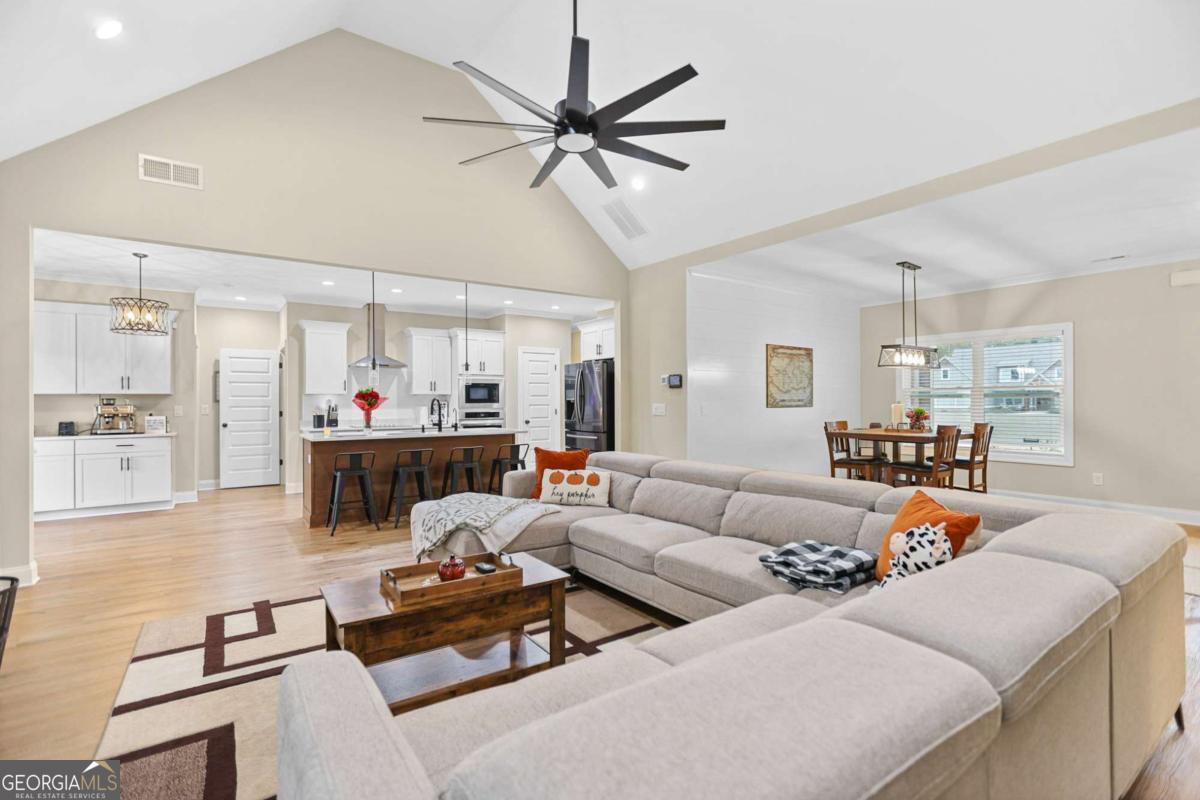 294 Conner Lane Williamson, GA 30292 - Photo 18 of 62 a living room with furniture and kitchen view