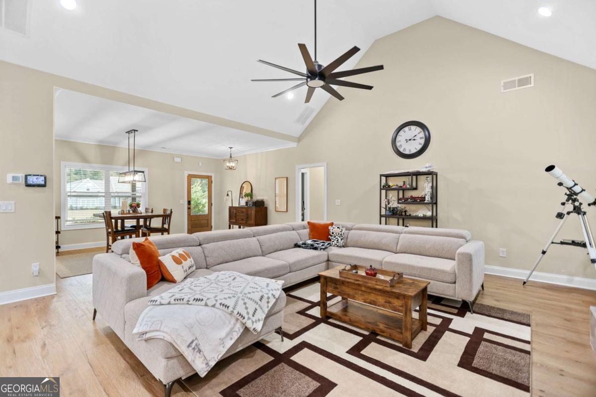 294 Conner Lane Williamson, GA 30292 - Photo 19 of 62 a living room with furniture and a clock
