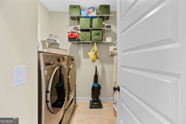 a bathroom with double sink and a mirror