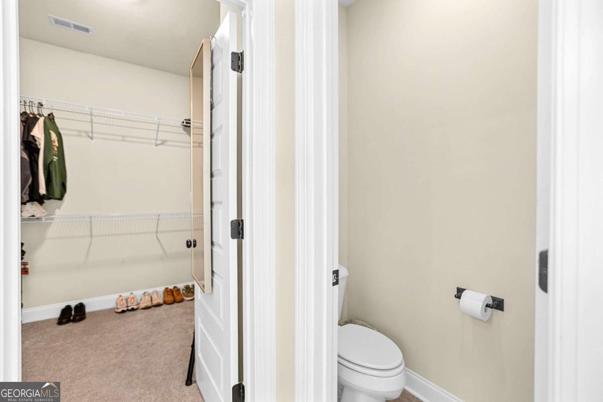 294 Conner Lane Williamson, GA 30292 - Photo 37 of 62 a bathroom with a shower and a toilet