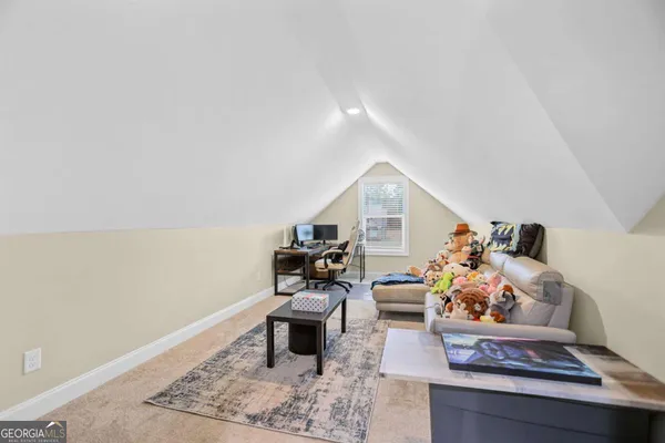 a bedroom with a bed and a ceiling fan