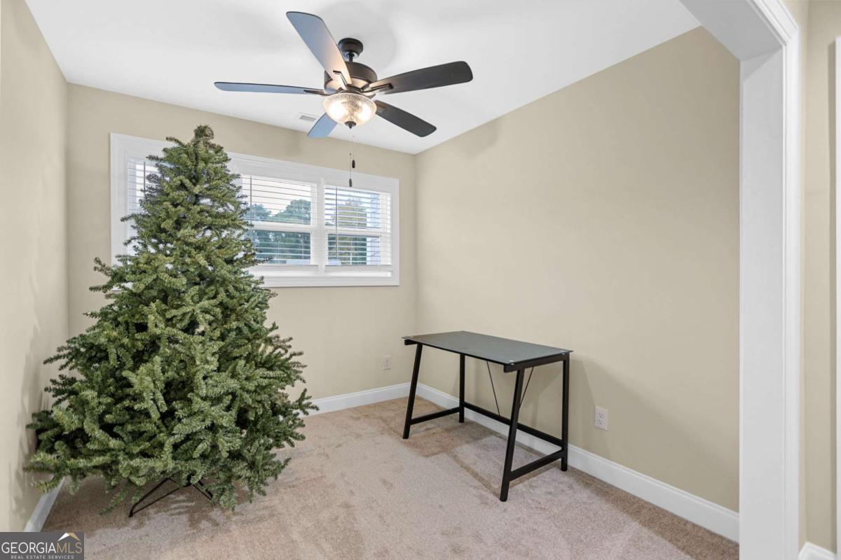 294 Conner Lane Williamson, GA 30292 - Photo 47 of 62 a view of a livingroom with a ceiling fan and a window