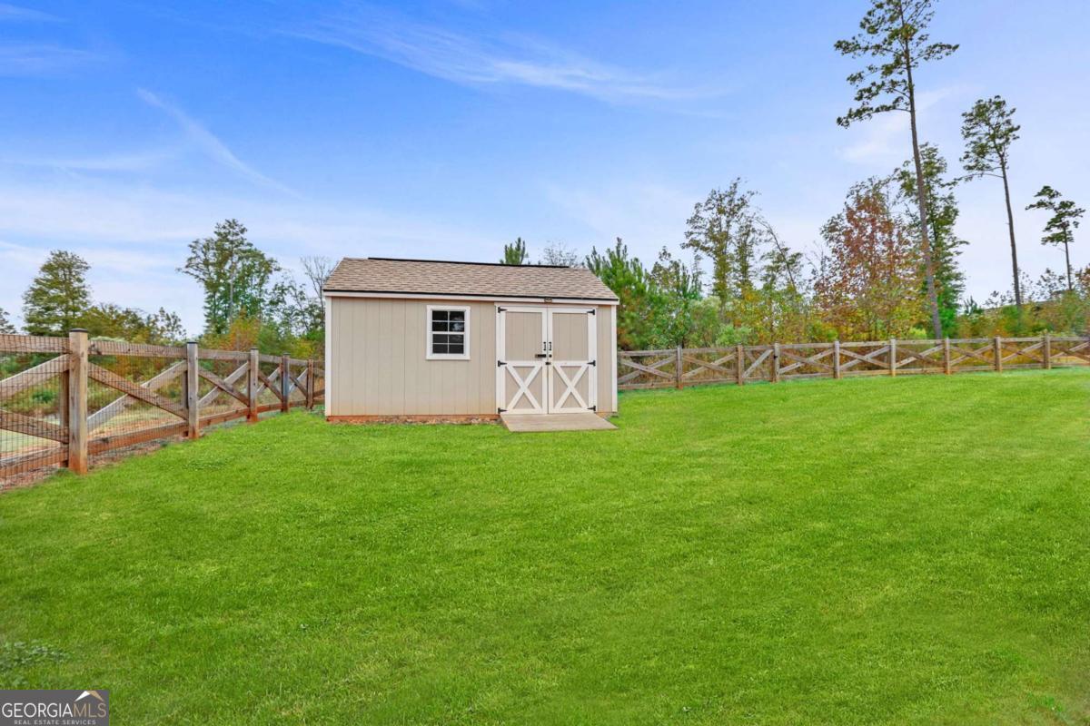 294 Conner Lane Williamson, GA 30292 - Photo 55 of 62 a view of a house with a yard