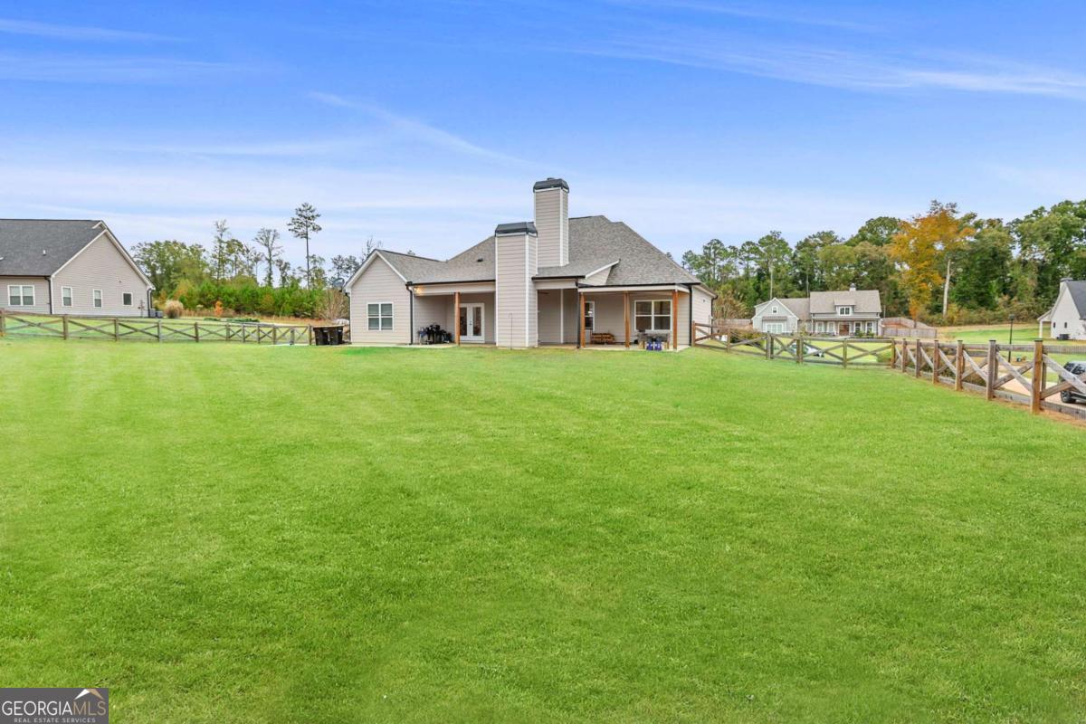 294 Conner Lane Williamson, GA 30292 - Photo 56 of 62 a front view of a house with a garden