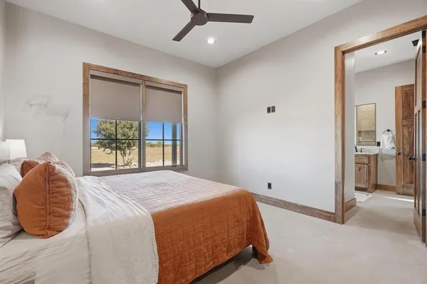 a bedroom with bed and window