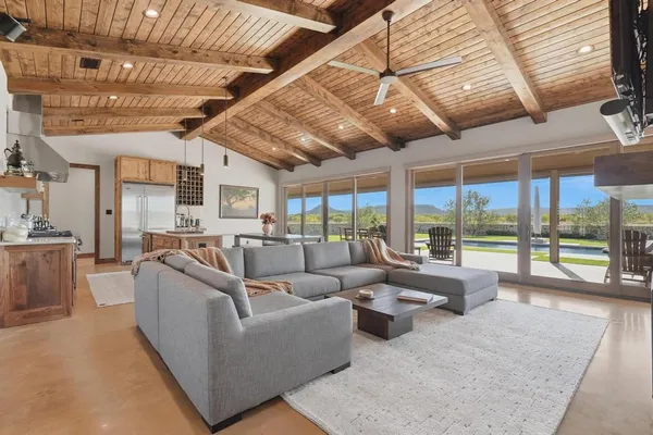 a living room with furniture and a large window