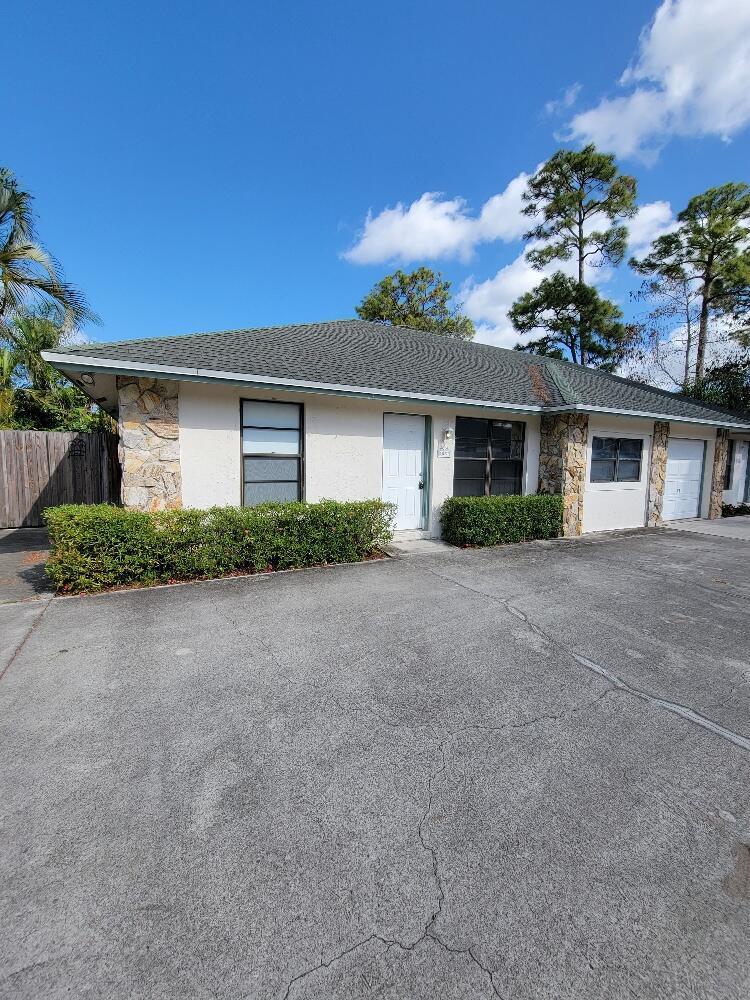 1087 Goldenrod Road Wellington, FL 33414 - Photo 1 of 15 front
