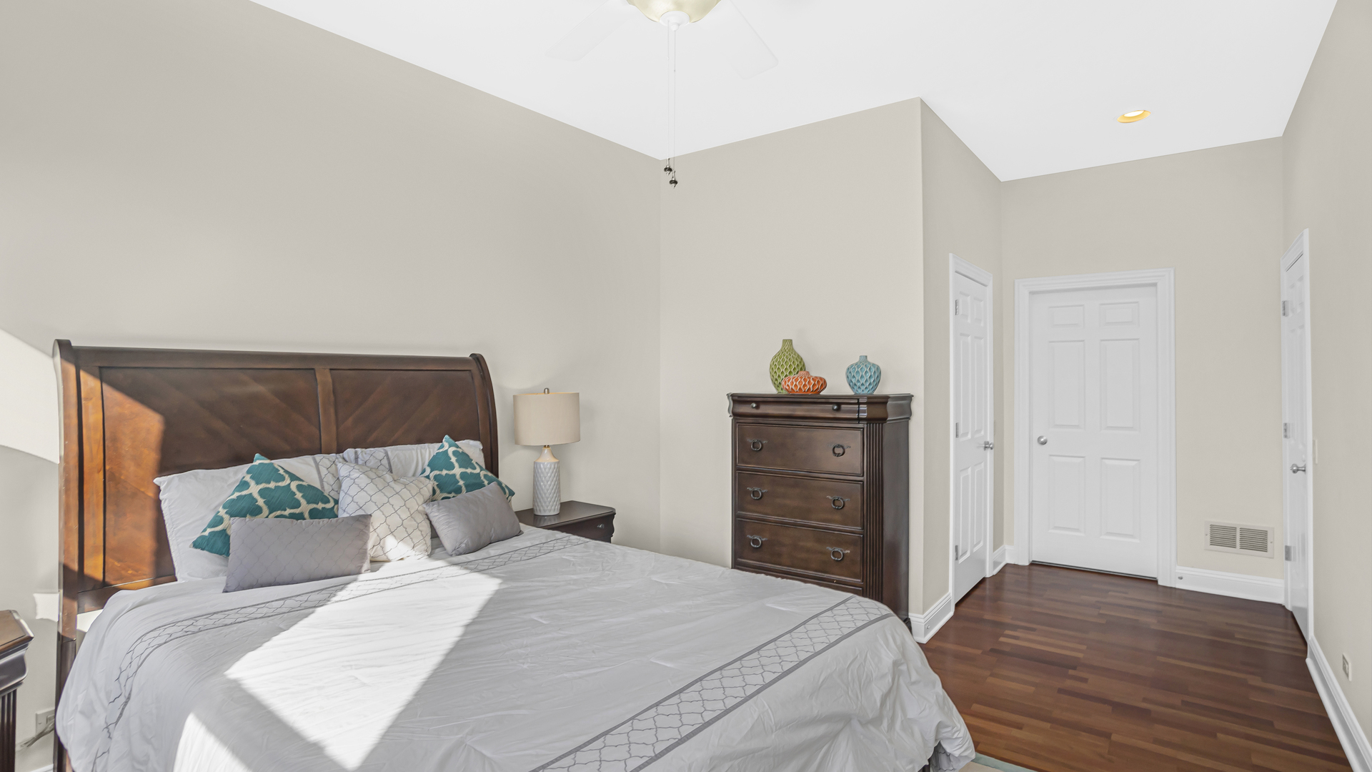 1908 West Irving Park Road, Unit 301 Chicago, IL 60613 - Photo 12 of 24 a bedroom with a bed and a dresser