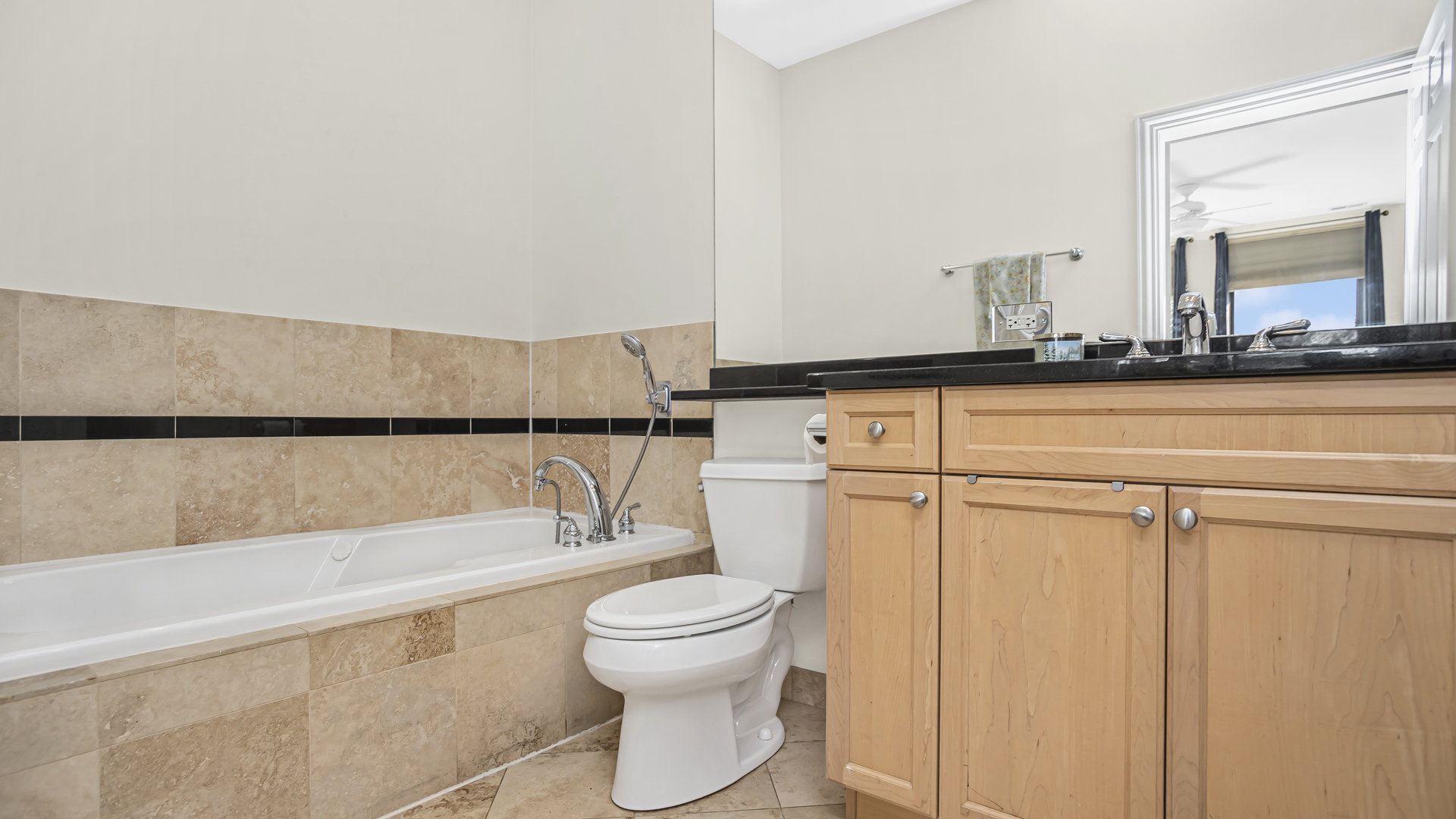 1908 West Irving Park Road, Unit 301 Chicago, IL 60613 - Photo 14 of 24 a bathroom with a toilet a sink and a bathtub