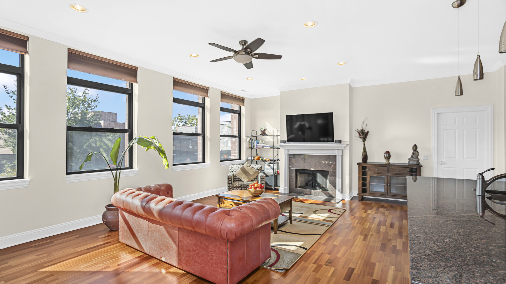 1908 West Irving Park Road, Unit 301 Chicago, IL 60613 - Photo 4 of 24 a living room with furniture fireplace and flat screen tv