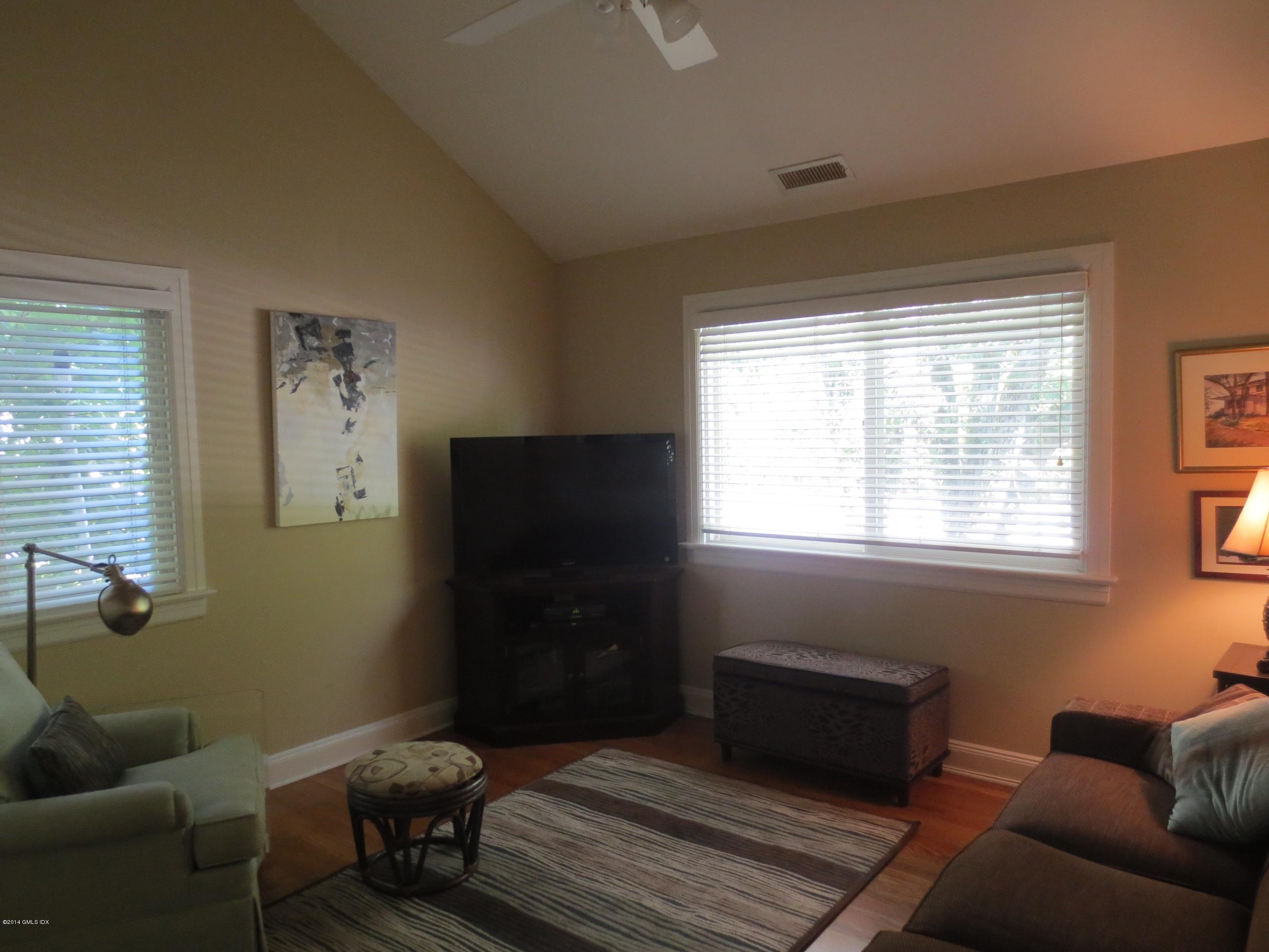333 Palmer Hill Road, Unit 1D Riverside, CT 06878 - Photo 11 of 12 a living room with furniture and a window