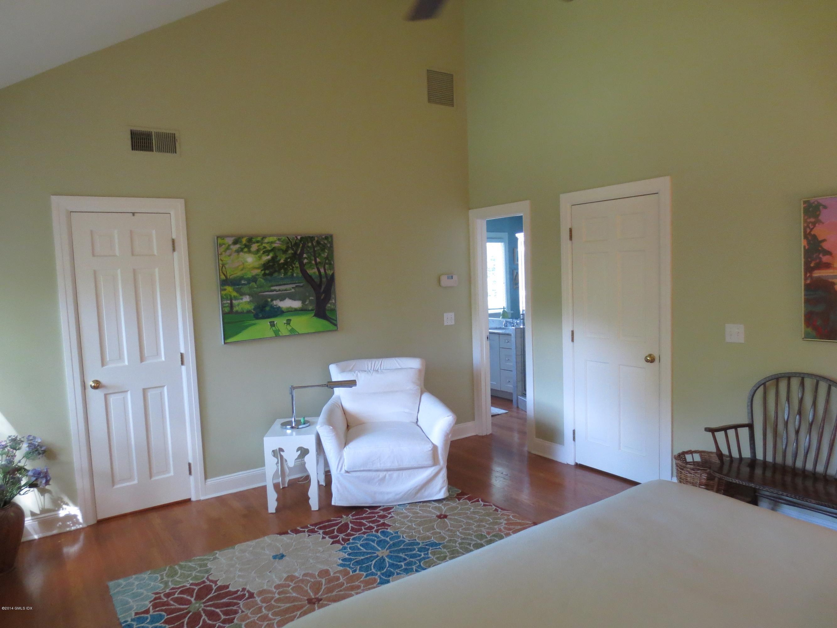 333 Palmer Hill Road, Unit 1D Riverside, CT 06878 - Photo 8 of 12 a living room with furniture rug and wooden floor