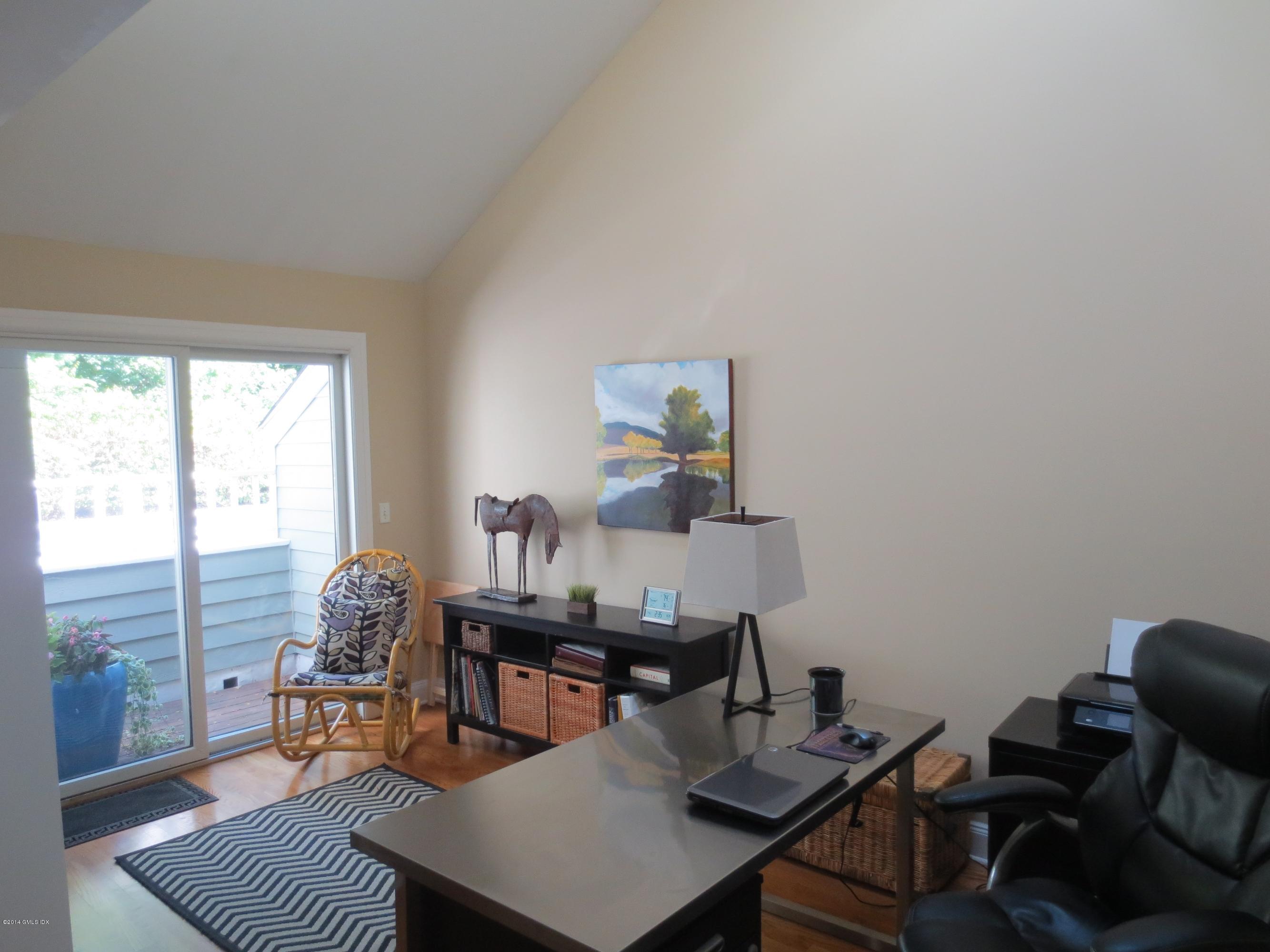 333 Palmer Hill Road, Unit 1D Riverside, CT 06878 - Photo 10 of 12 a view of a workspace with furniture and a potted plant