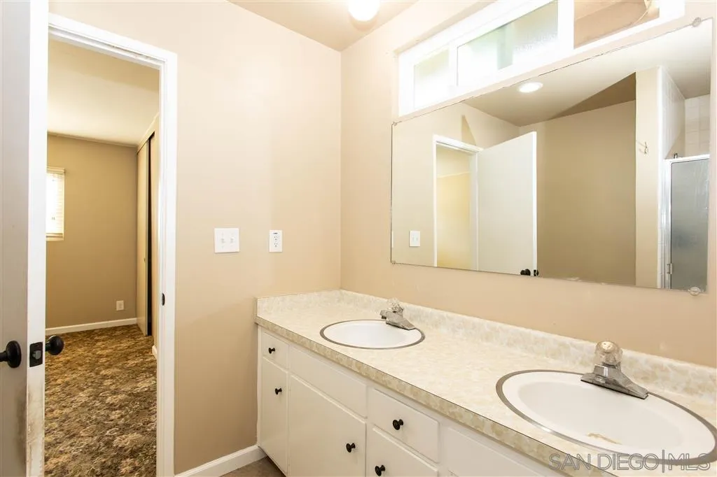 5939 Normandie Place Riverside, CA 92506 - Photo 15 of 21 a bathroom with a sink double vanity and a mirror