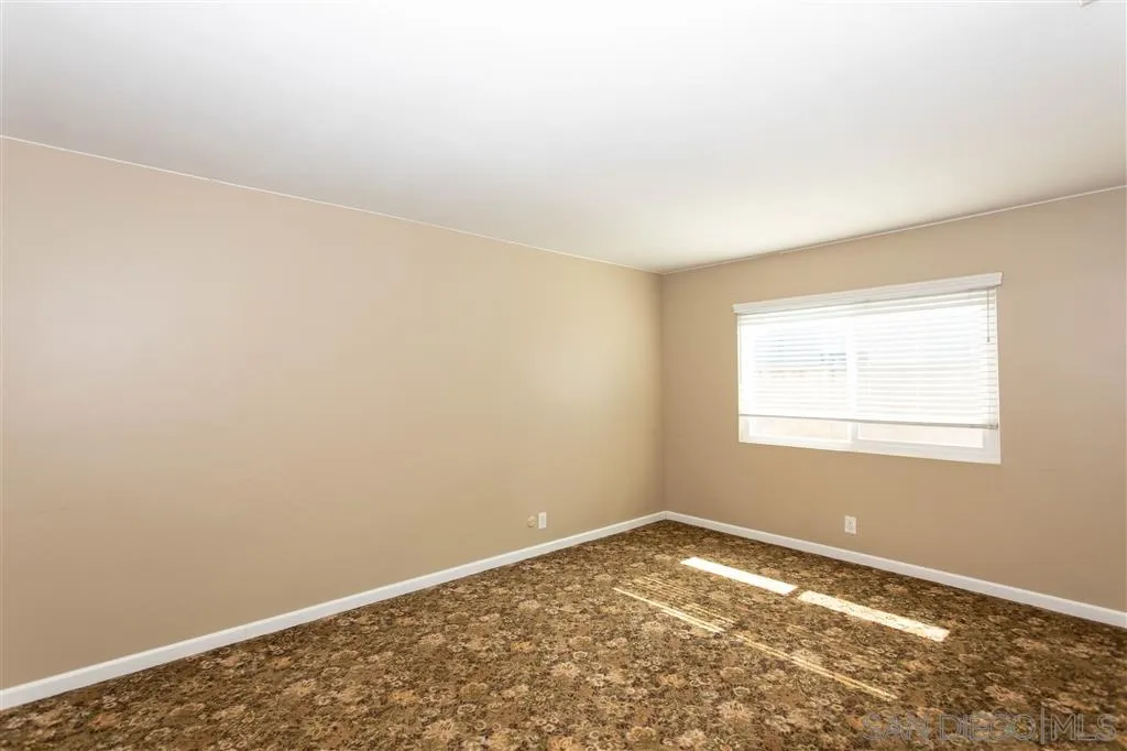 5939 Normandie Place Riverside, CA 92506 - Photo 9 of 21 an empty room with a window