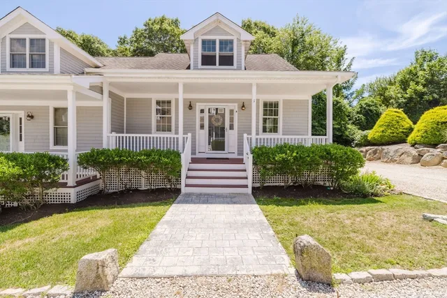 a front view of a house with garden