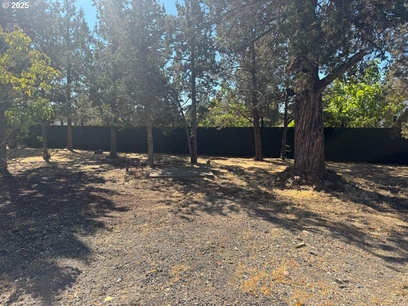 12292 Southwest Lords Place Terrebonne, OR 97760 - Photo 18 of 20 a backyard of a house with lots of green space