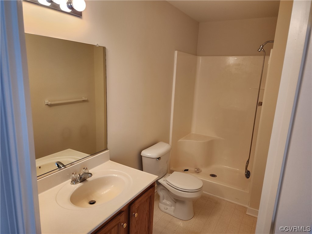 8657 Millstream Drive Henrico, VA 23228 - Photo 12 of 19 a bathroom with a sink toilet and shower