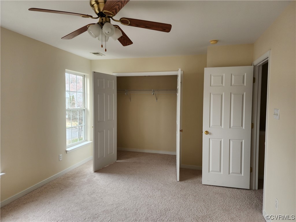 8657 Millstream Drive Henrico, VA 23228 - Photo 15 of 19 an empty room with windows and fan
