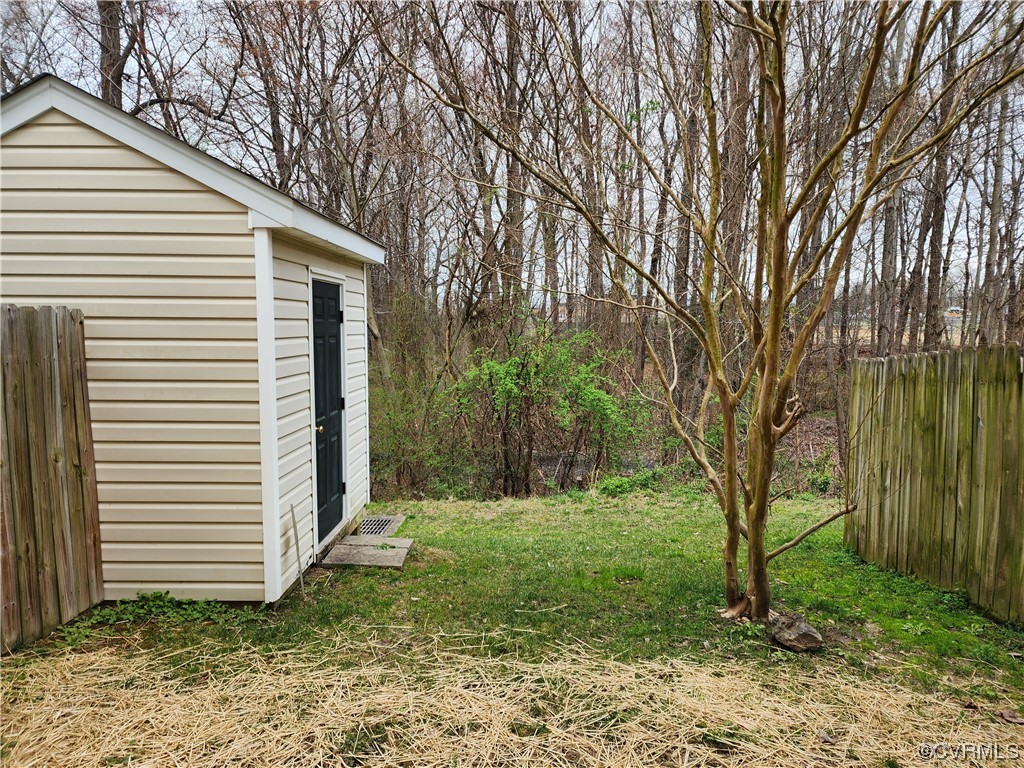 8657 Millstream Drive Henrico, VA 23228 - Photo 17 of 19 a view of a house with a yard