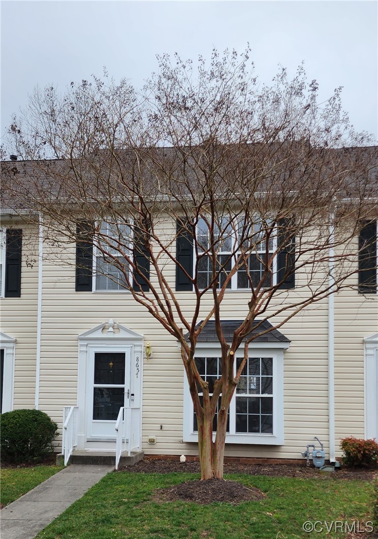 8657 Millstream Drive Henrico, VA 23228 - Photo 18 of 19 a front view of a house with a yard