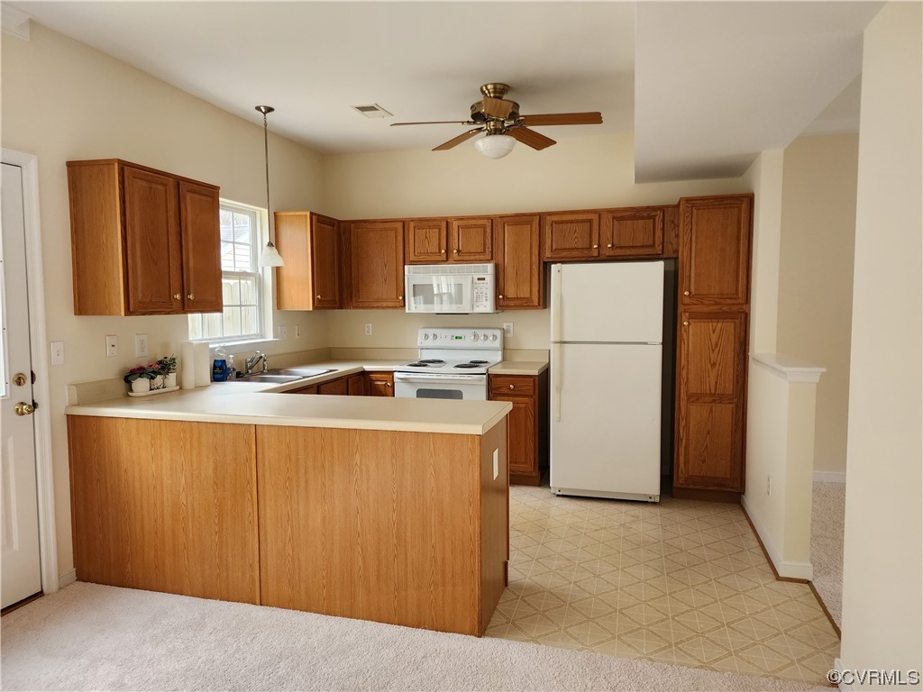 8657 Millstream Drive Henrico, VA 23228 - Photo 6 of 19 a kitchen with stainless steel appliances granite countertop a refrigerator a stove a sink dishwasher and a refrigerator with wooden floor