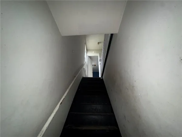 a view of a hallway with a white walls