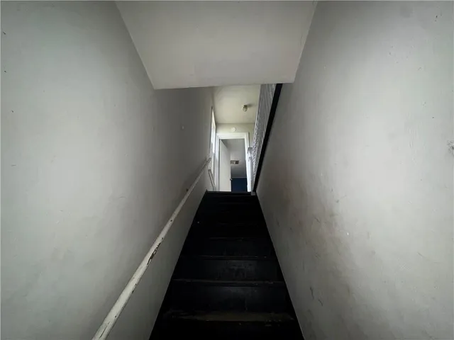 a view of a hallway with a white walls
