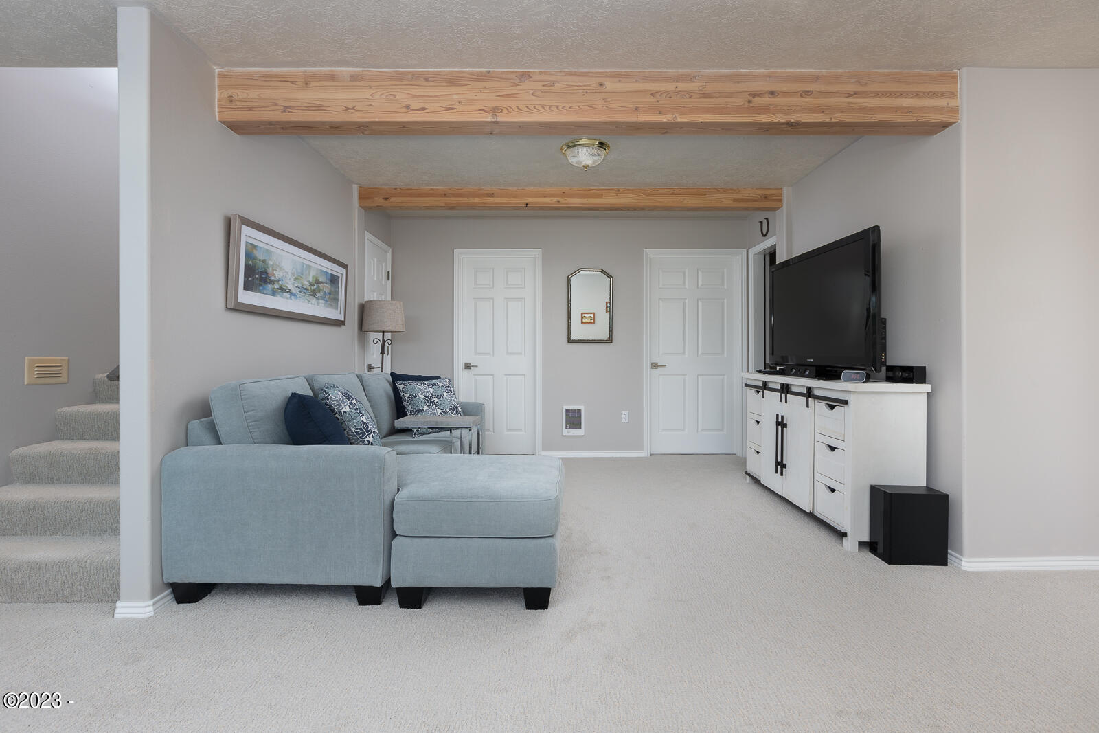 6250 Nestucca Ridge Road Pacific City, OR 97135 - Photo 15 of 31 a living room with furniture and a flat screen tv