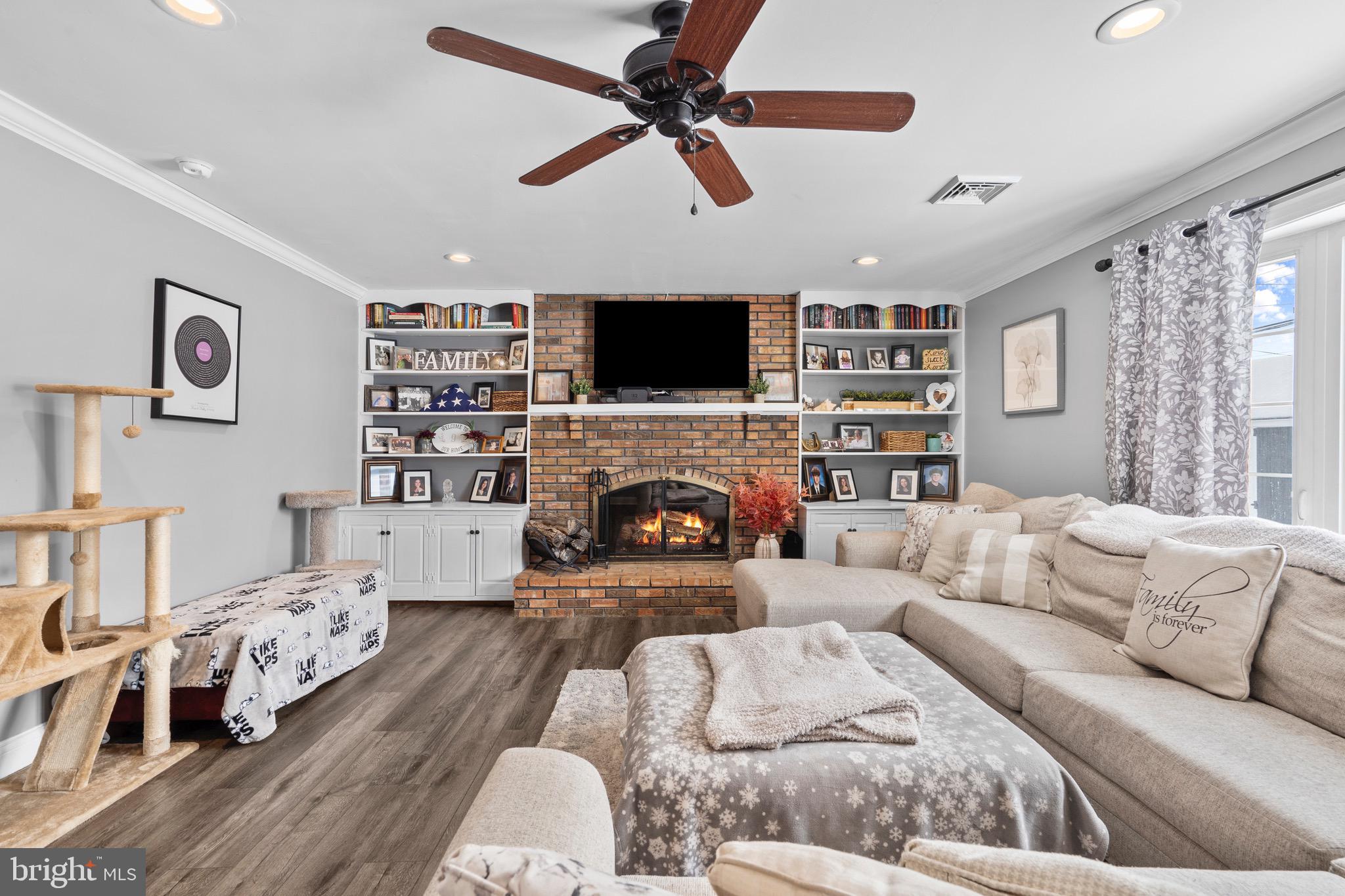 9 Honey Locust Road Levittown, PA 19056 - Photo 1 of 34 a living room with furniture fireplace and a flat screen tv