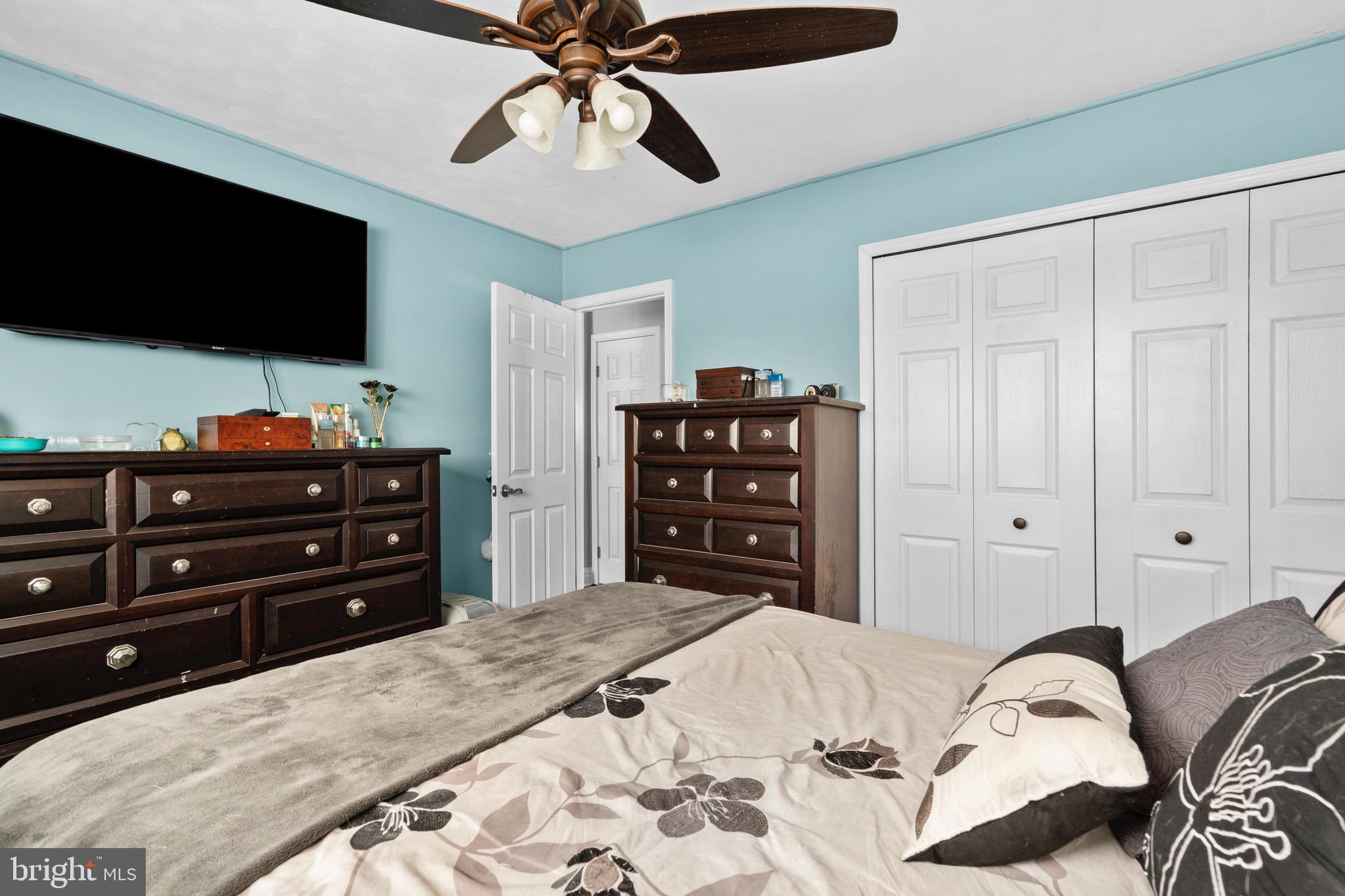 9 Honey Locust Road Levittown, PA 19056 - Photo 11 of 34 a bedroom with a bed and a flat screen tv