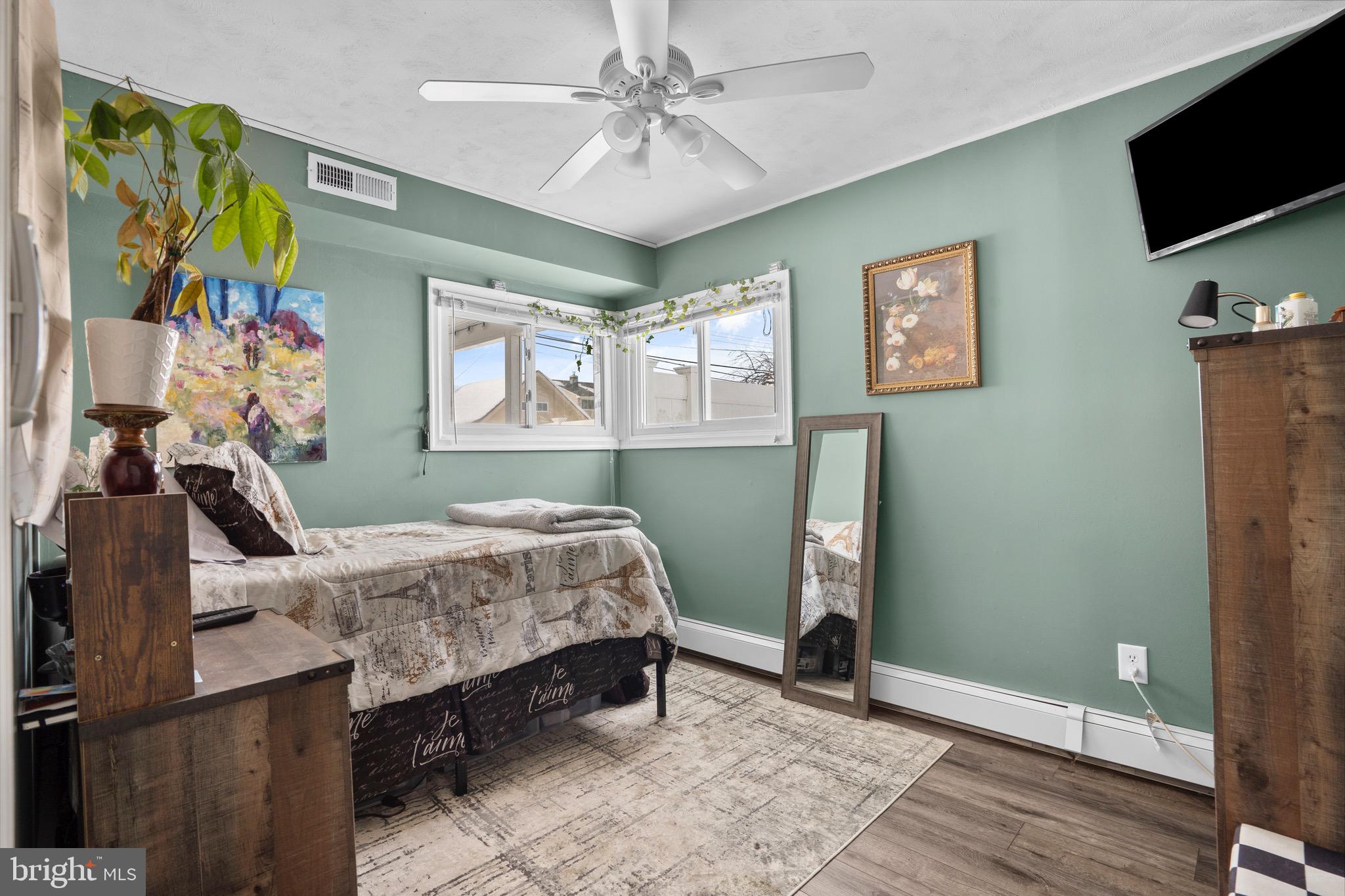 9 Honey Locust Road Levittown, PA 19056 - Photo 12 of 34 a bedroom with a bed and a flat screen tv