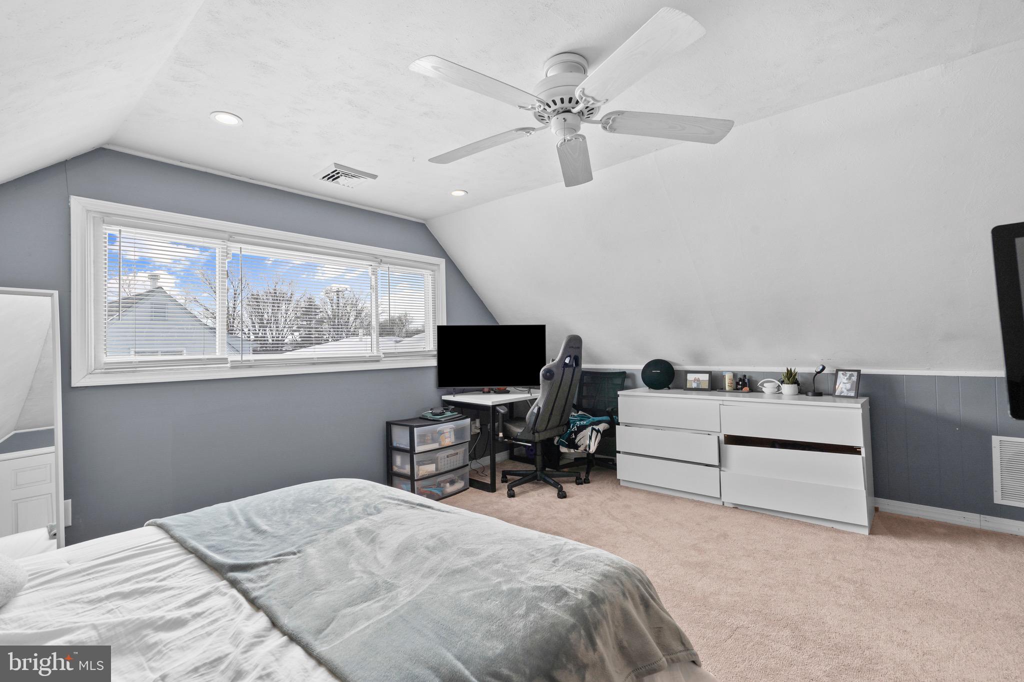 9 Honey Locust Road Levittown, PA 19056 - Photo 18 of 34 a bedroom with a bed and a chair