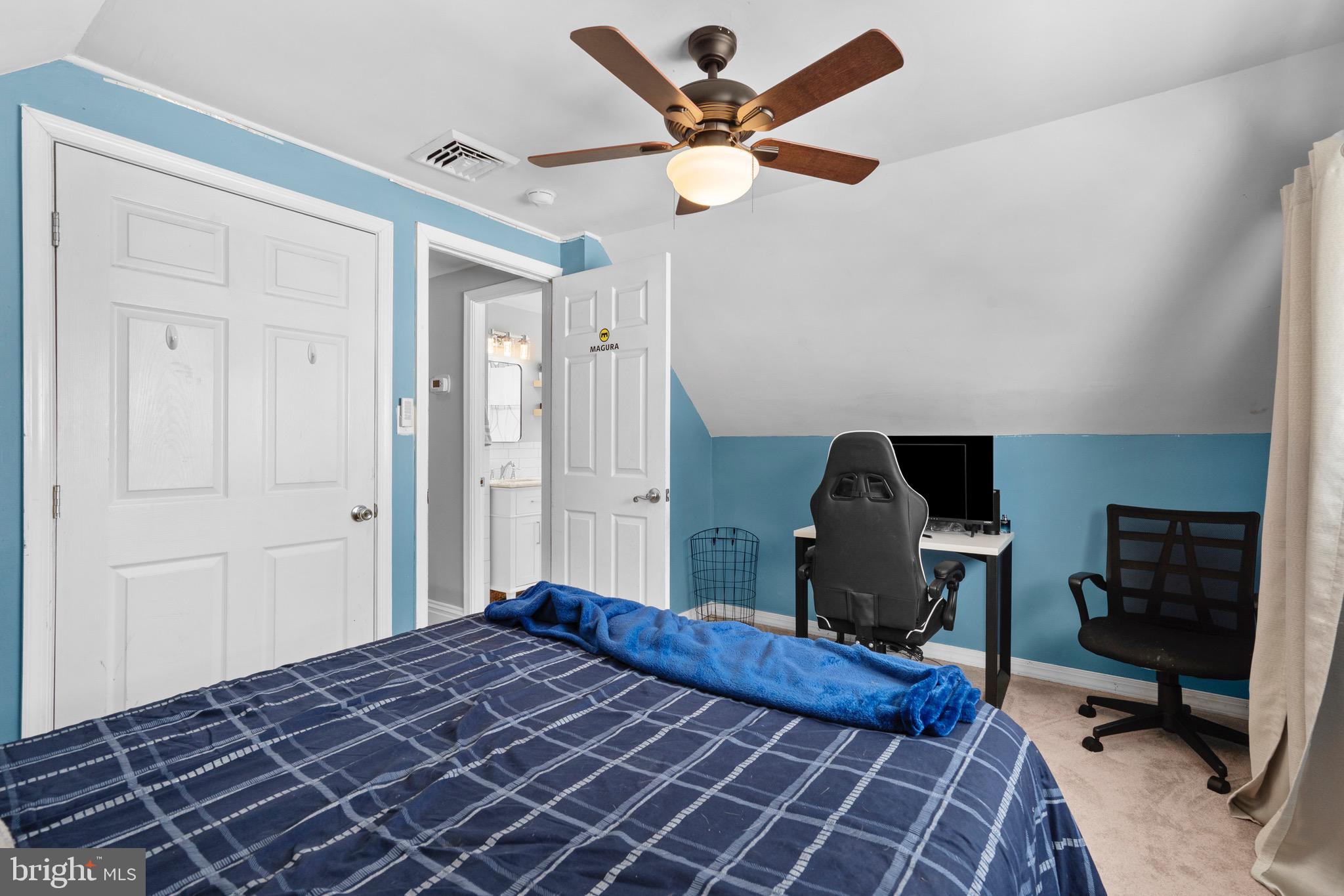 9 Honey Locust Road Levittown, PA 19056 - Photo 22 of 34 a bedroom with a bed and a chandelier