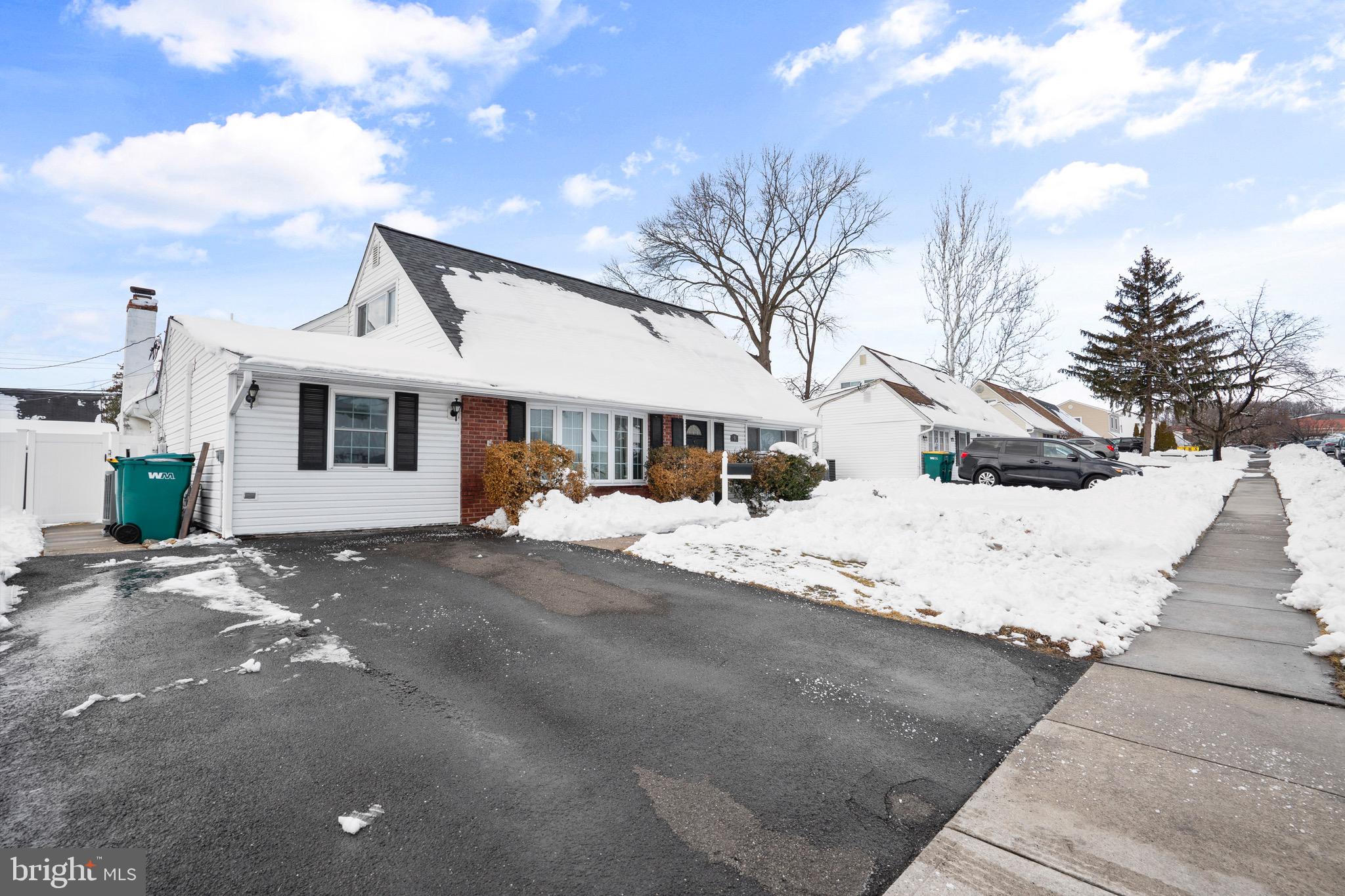 9 Honey Locust Road Levittown, PA 19056 - Photo 26 of 34 a front view of a house with a road
