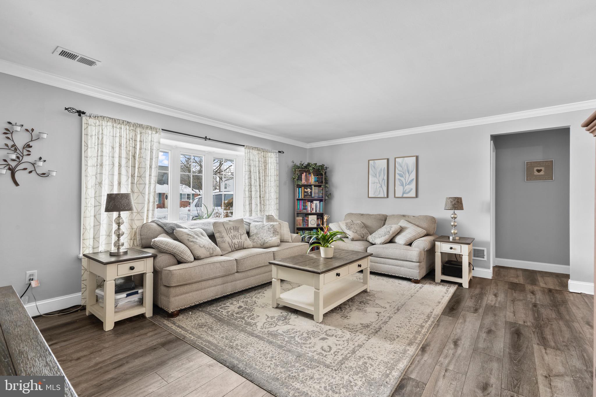 9 Honey Locust Road Levittown, PA 19056 - Photo 7 of 34 a living room with furniture and a large window