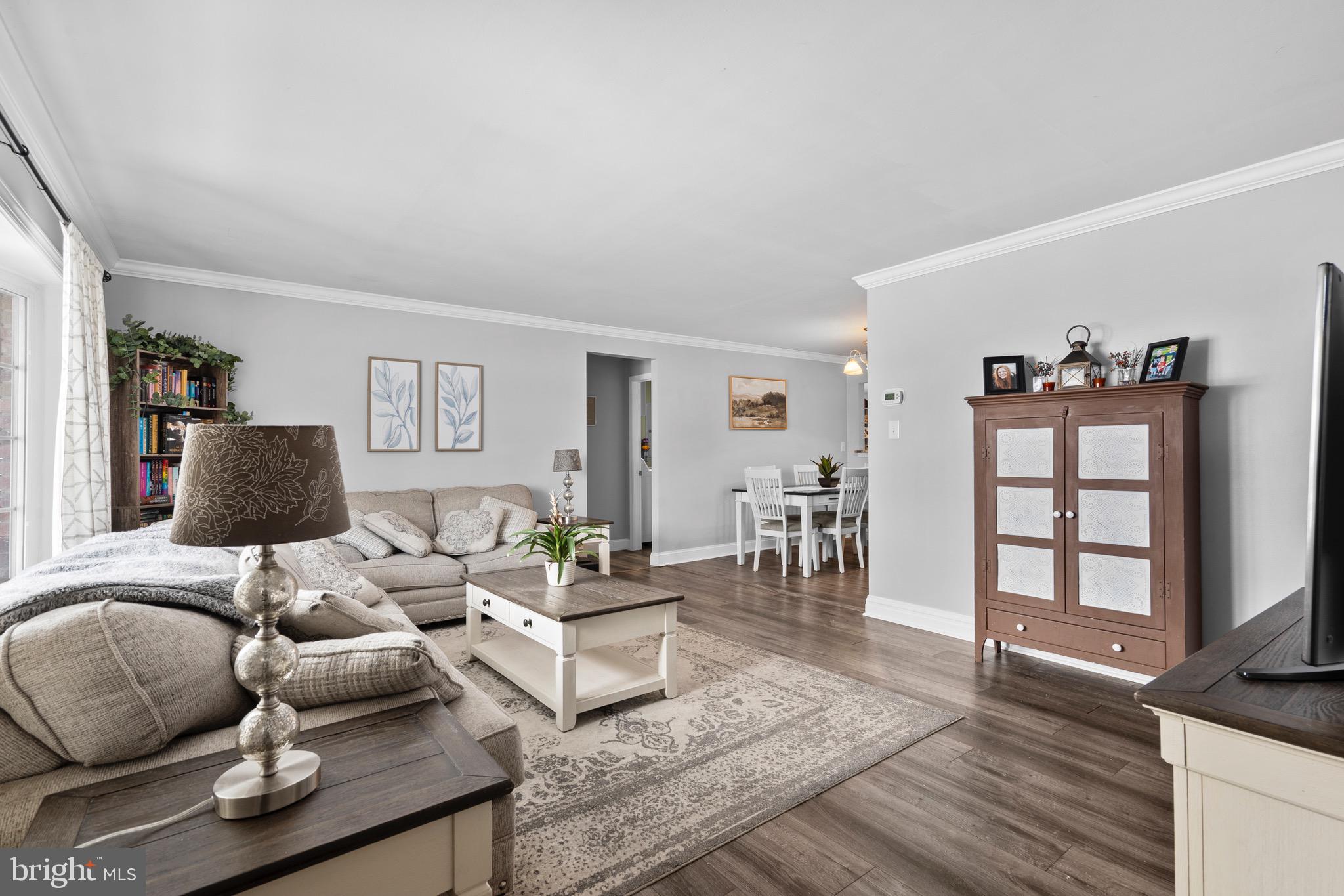 9 Honey Locust Road Levittown, PA 19056 - Photo 9 of 34 a living room with furniture and wooden floor