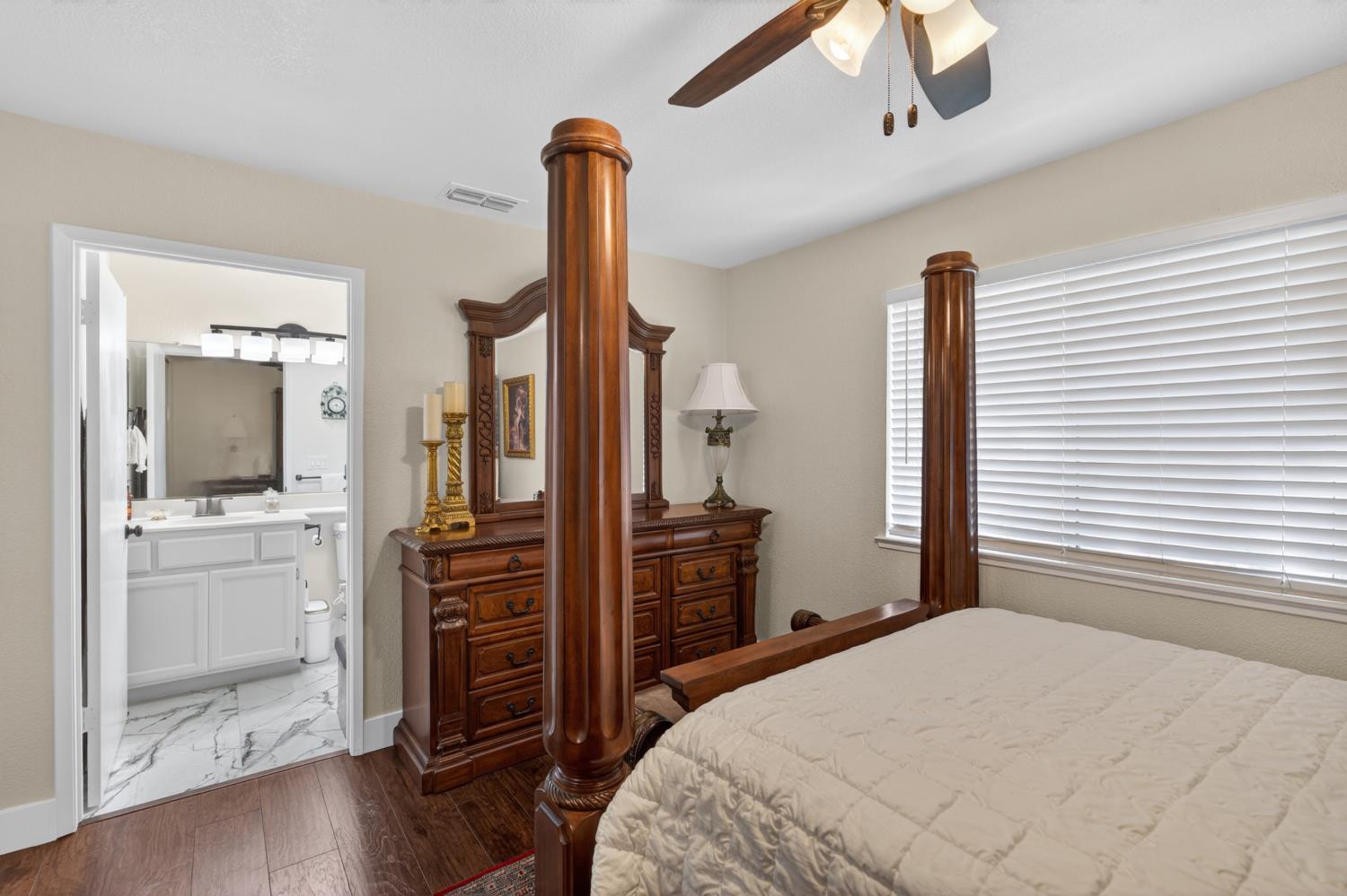 8020 Walerga Road, Unit 1140 Antelope, CA 95843 - Photo 25 of 37 a bedroom with a bed and wooden floor