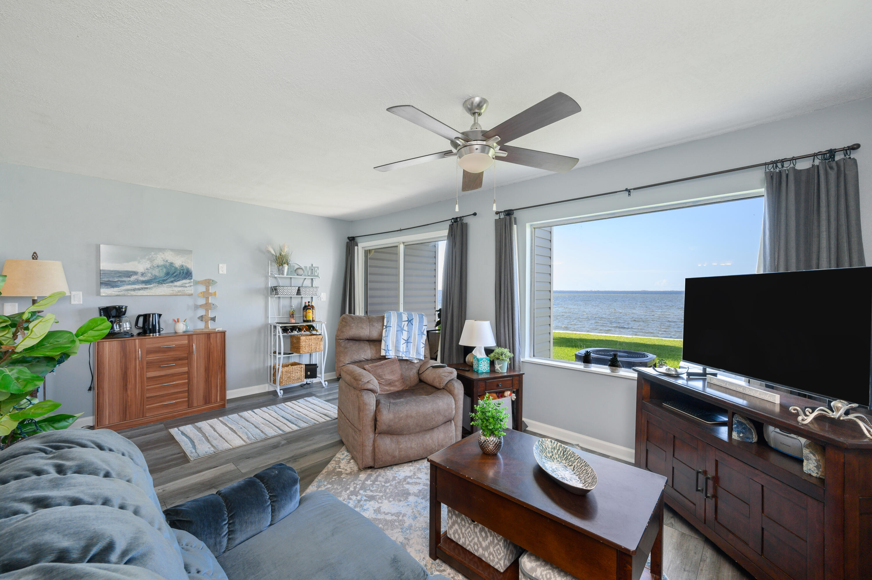 101 Old Ferry Road, Unit 16B Shalimar, FL 32579 - Photo 6 of 26 a living room with furniture and a flat screen tv