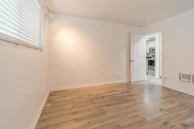 a view of wooden floor in an empty room
