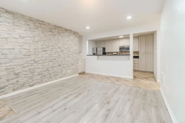 a view of kitchen with wooden floor