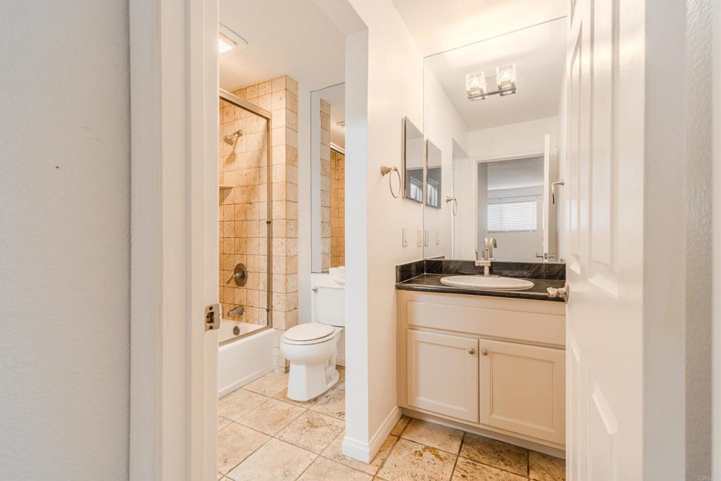 9860 Dale Avenue, Unit D10 Spring Valley, CA 91977 - Photo 28 of 55 a bathroom with a granite countertop sink toilet and shower