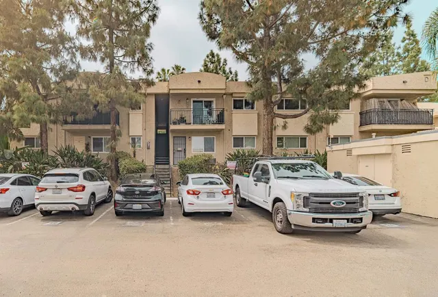 a view of a cars parked in front of a house