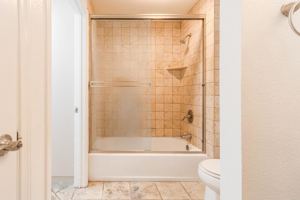 9860 Dale Avenue, Unit D10 Spring Valley, CA 91977 - Photo 31 of 55 a bathroom with a bathtub and a shower